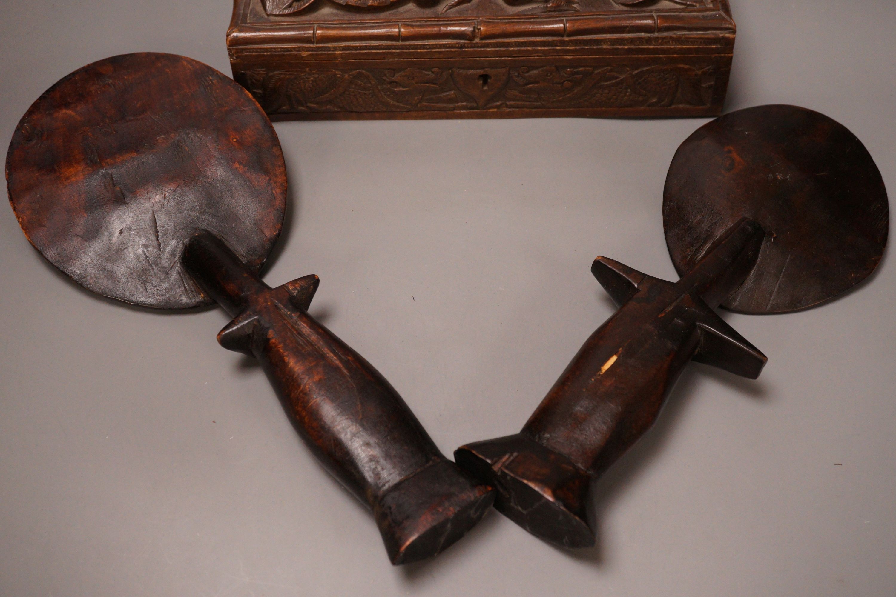 Two carved African wooden figures, together with a Burmese carved dragon wooden box